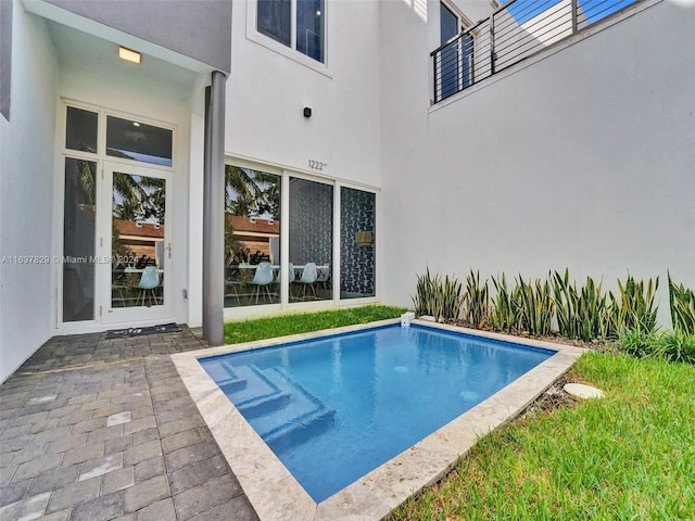 view of pool featuring a patio area