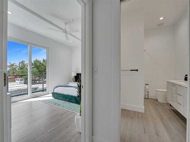 bedroom featuring ceiling fan, access to exterior, and light hardwood / wood-style floors