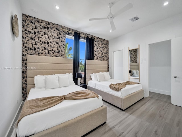 bedroom featuring ceiling fan and light wood-type flooring