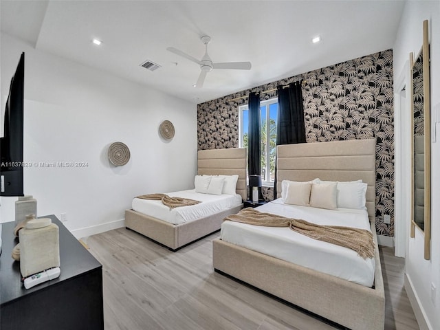 bedroom featuring ceiling fan and light hardwood / wood-style flooring