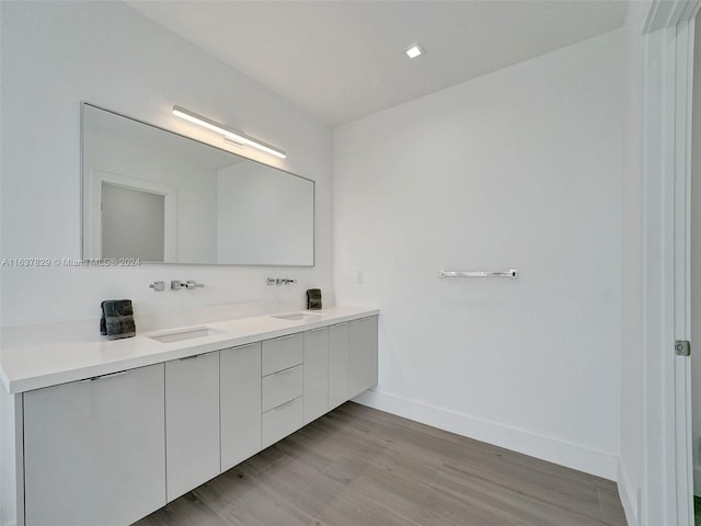 bathroom with vanity and hardwood / wood-style floors