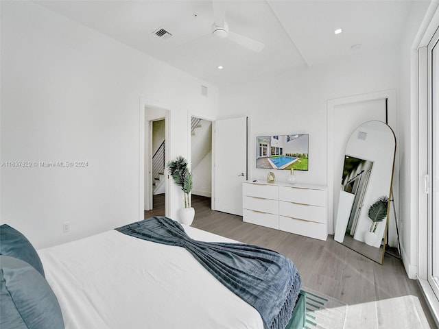 bedroom featuring hardwood / wood-style flooring and ceiling fan