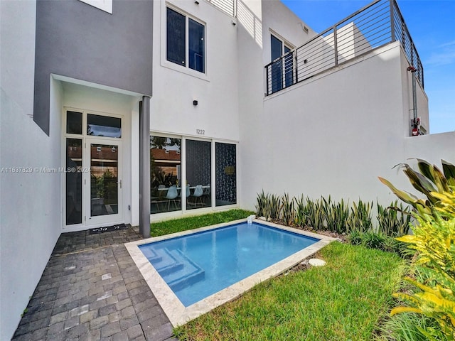 view of swimming pool featuring a patio area