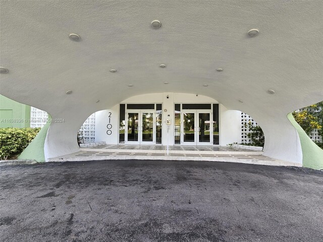 view of exterior entry featuring french doors