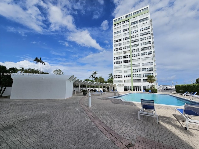 view of swimming pool with a patio