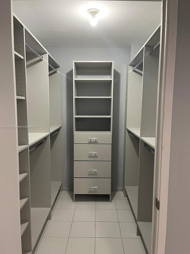 spacious closet featuring light tile patterned floors