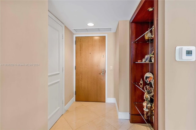 hall featuring tile patterned flooring