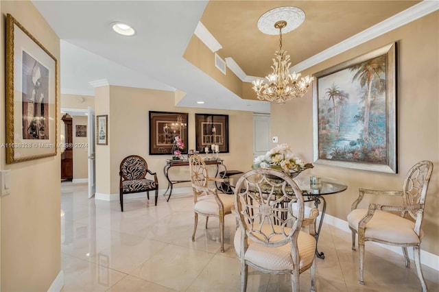 dining room with a notable chandelier, ornamental molding, and light tile patterned floors