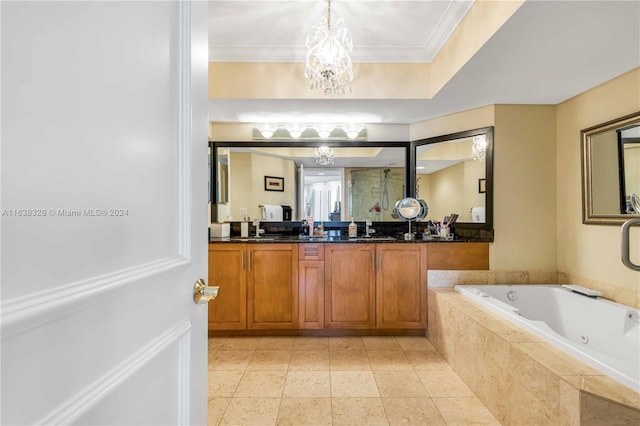 bathroom with double vanity, tile patterned floors, a chandelier, a tray ceiling, and ornamental molding