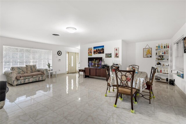 dining room with light tile patterned floors