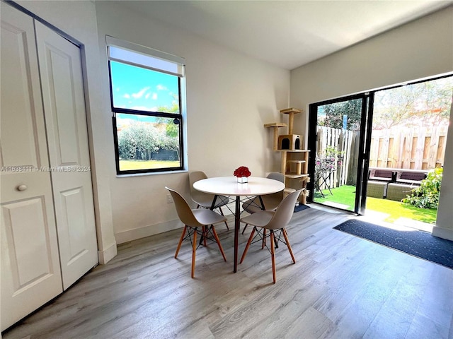 dining area with light wood-type flooring