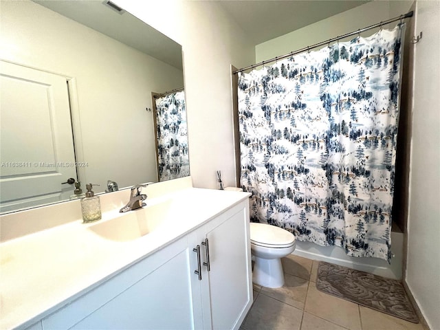 full bathroom featuring tile patterned floors, toilet, shower / tub combo, and vanity