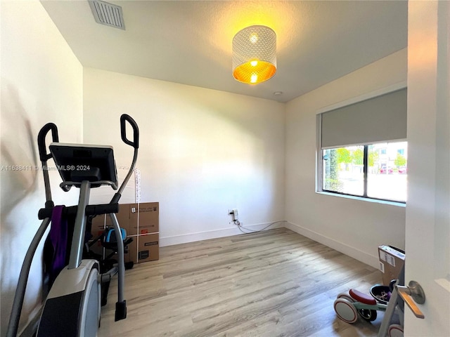 workout room with light wood-type flooring