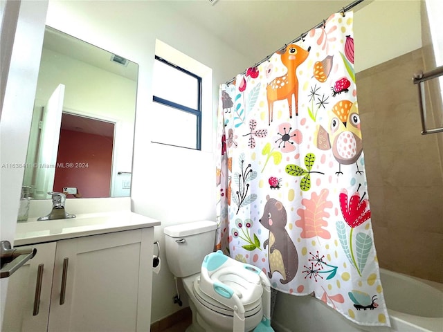 full bathroom with vanity, shower / bath combination with curtain, and toilet