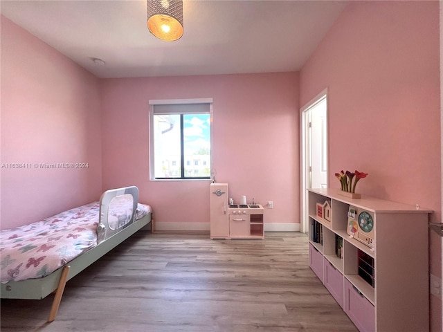 bedroom with light wood-type flooring