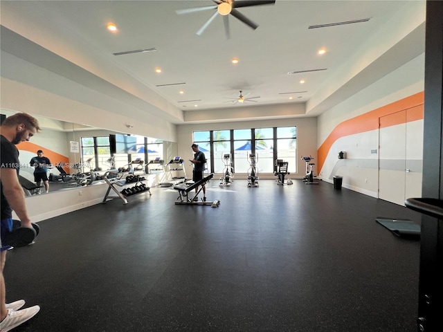 gym featuring a wealth of natural light and ceiling fan