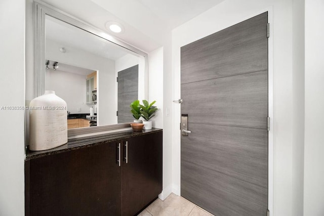 bathroom with vanity and tile patterned flooring