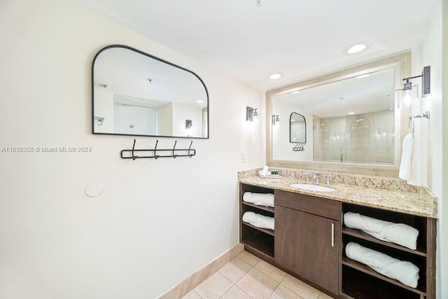 bathroom with vanity and tile patterned flooring