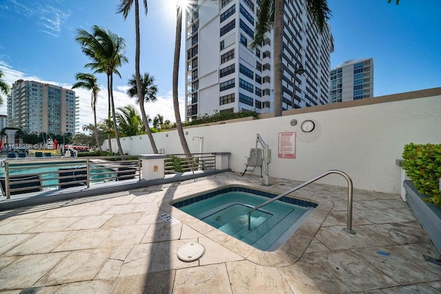 view of pool featuring a community hot tub