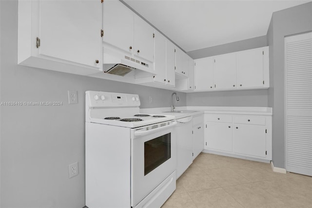 kitchen with light tile patterned flooring, sink, white cabinetry, and electric range