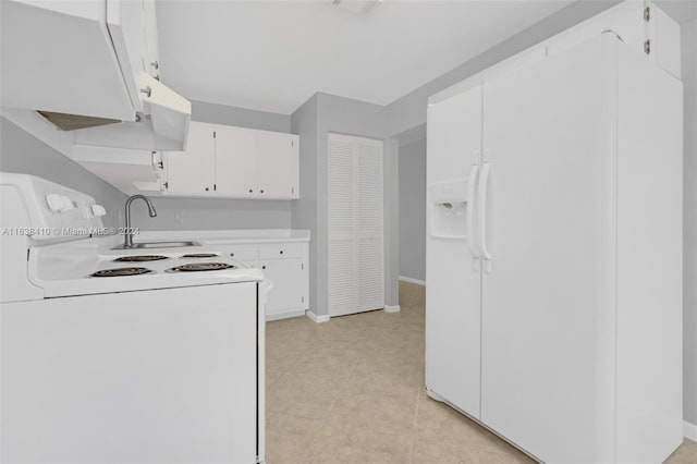 kitchen featuring sink, light tile patterned flooring, white cabinets, and white appliances