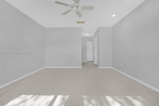 unfurnished room with carpet floors and ceiling fan