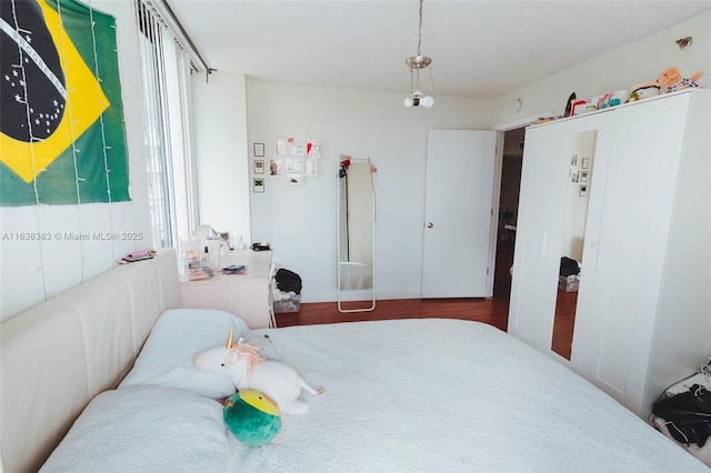 bedroom featuring dark hardwood / wood-style flooring