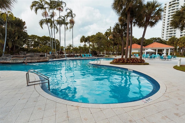 view of swimming pool featuring a gazebo and a patio area