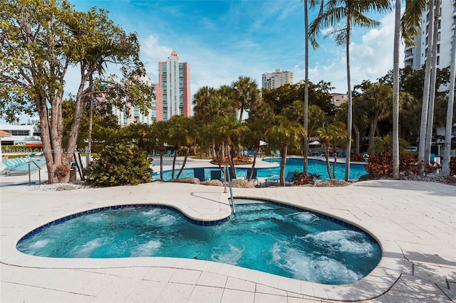 view of swimming pool featuring a patio area