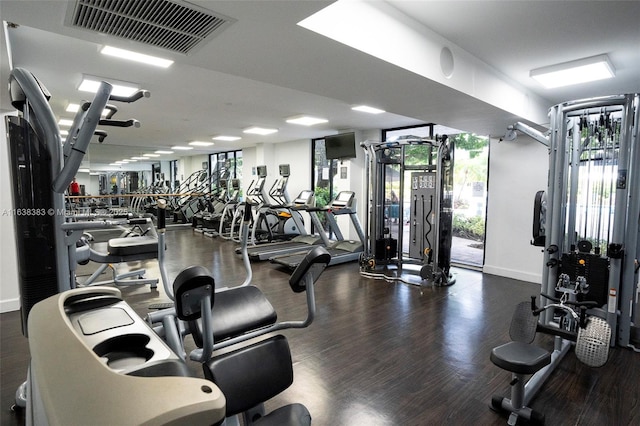 gym featuring dark hardwood / wood-style floors