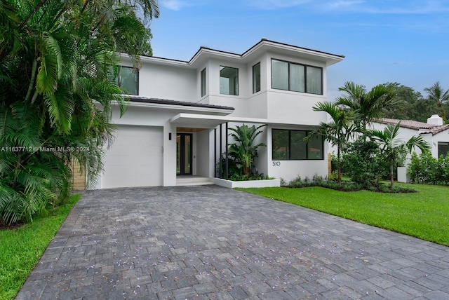 modern home with a garage and a front yard