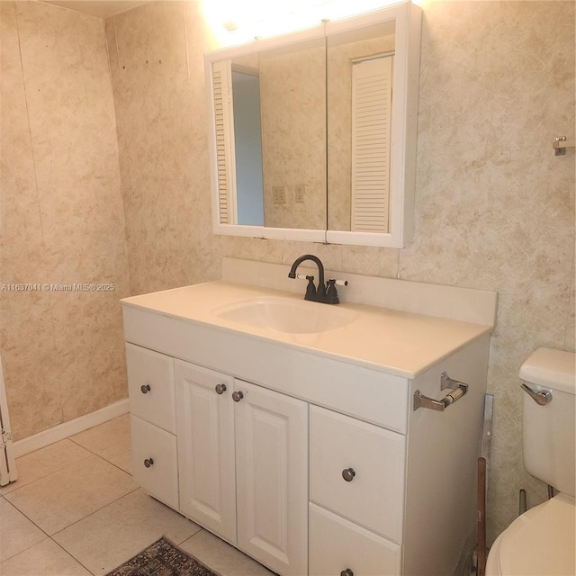 5800 NW 64th Ave Unit 108, Tamarac, FL 33319 - bathroom with vanity, toilet, tile patterned flooring, and wallpapered walls