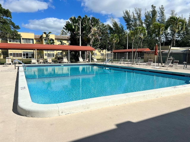 5800 NW 64th Ave Unit 108, Tamarac, FL 33319 - community pool featuring a patio