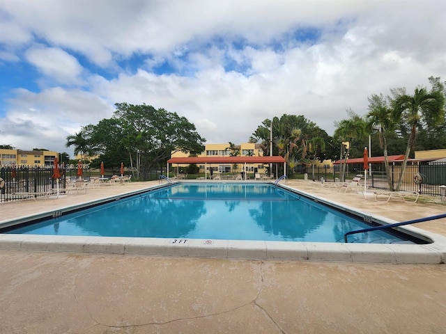 5800 NW 64th Ave Unit 108, Tamarac, FL 33319 - community pool with a patio area