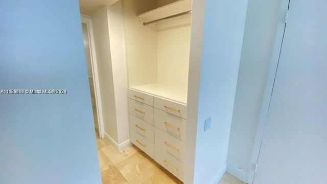 walk in closet featuring light tile patterned floors