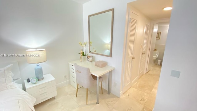 bathroom featuring tile patterned flooring and vanity