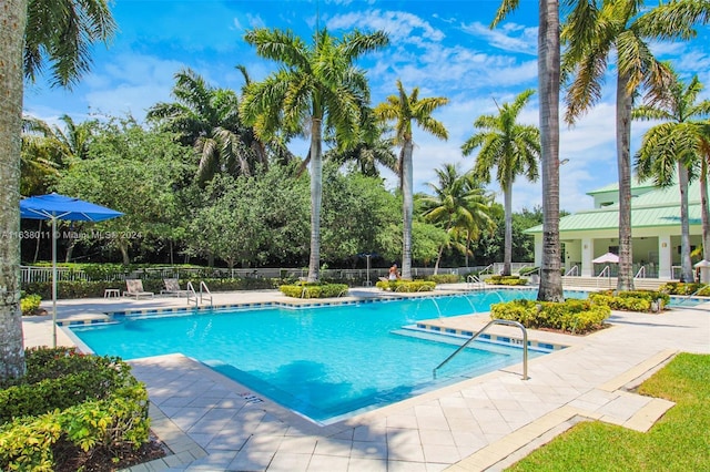 view of pool featuring a patio and pool water feature