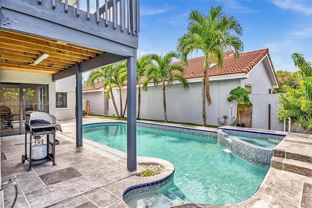 view of pool featuring an in ground hot tub, grilling area, a patio area, and pool water feature