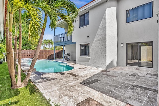 view of swimming pool with a patio and grilling area