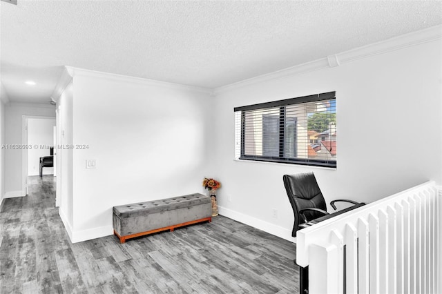 office area with a textured ceiling, ornamental molding, and hardwood / wood-style floors