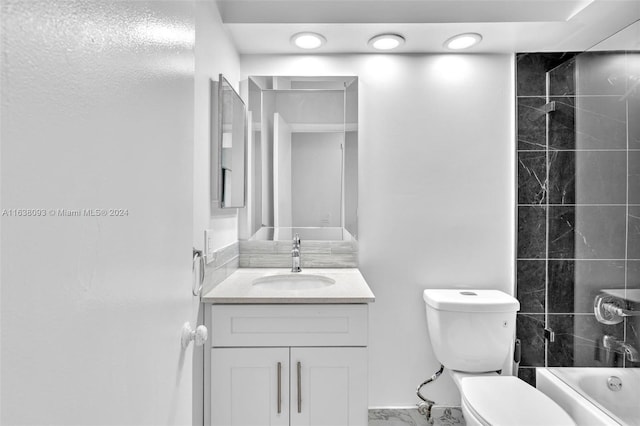 full bathroom featuring vanity, toilet, and tiled shower / bath