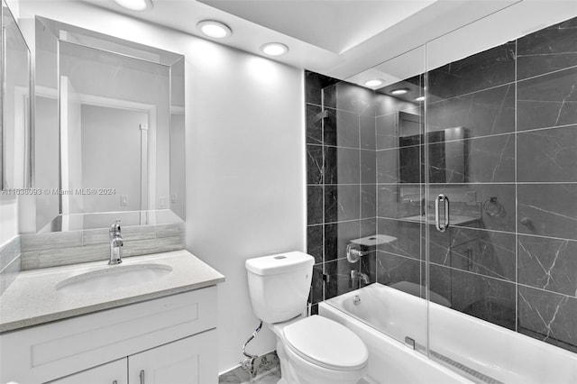 full bathroom featuring vanity, toilet, enclosed tub / shower combo, and tile patterned flooring