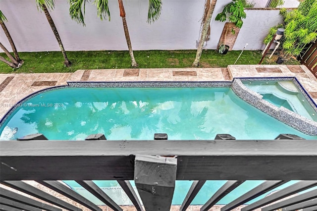 view of pool featuring a pergola and an in ground hot tub