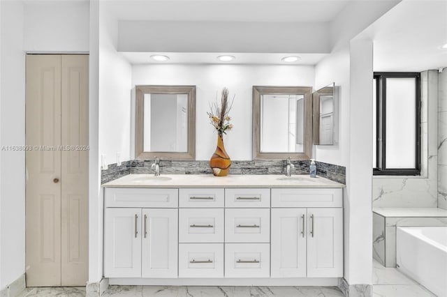 bathroom featuring tile patterned floors, double vanity, and a washtub