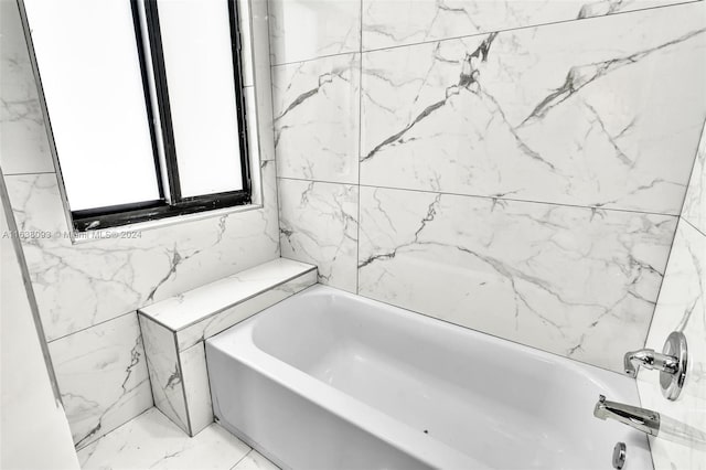 bathroom featuring tile walls and tile patterned flooring