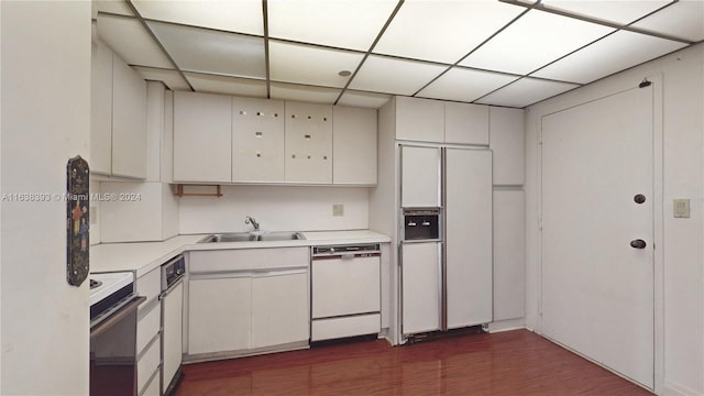 kitchen with range, white cabinetry, white dishwasher, and fridge with ice dispenser