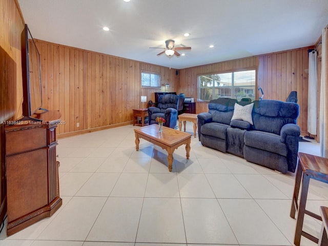 living room with recessed lighting, ceiling fan, baseboards, and light tile patterned floors