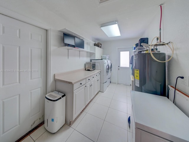 kitchen featuring light tile patterned floors, washing machine and dryer, water heater, light countertops, and open shelves