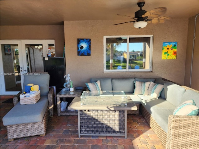 view of patio / terrace featuring ceiling fan and an outdoor living space