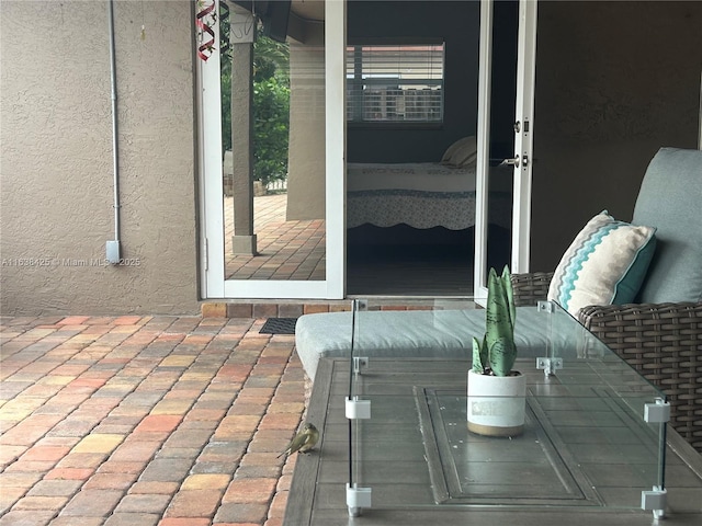 doorway to property with french doors and stucco siding